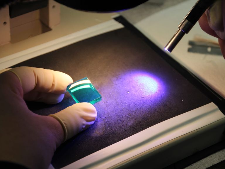 Optical bonding under inspection light